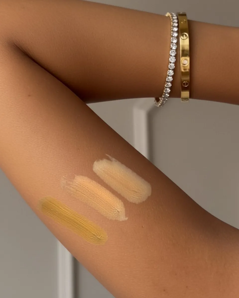 pearl, haze and ember brushed onto an arm